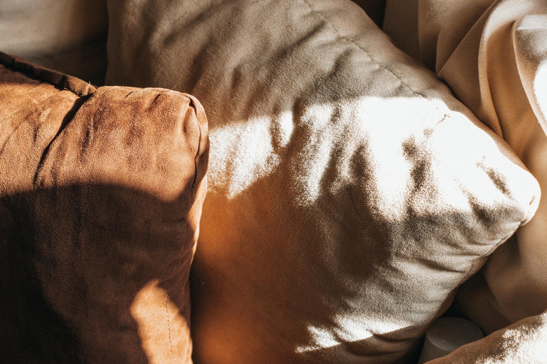 brown and white pillows